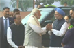 Modi, Manmohan shake hands amid row over secret meeting with Pakistan envoy